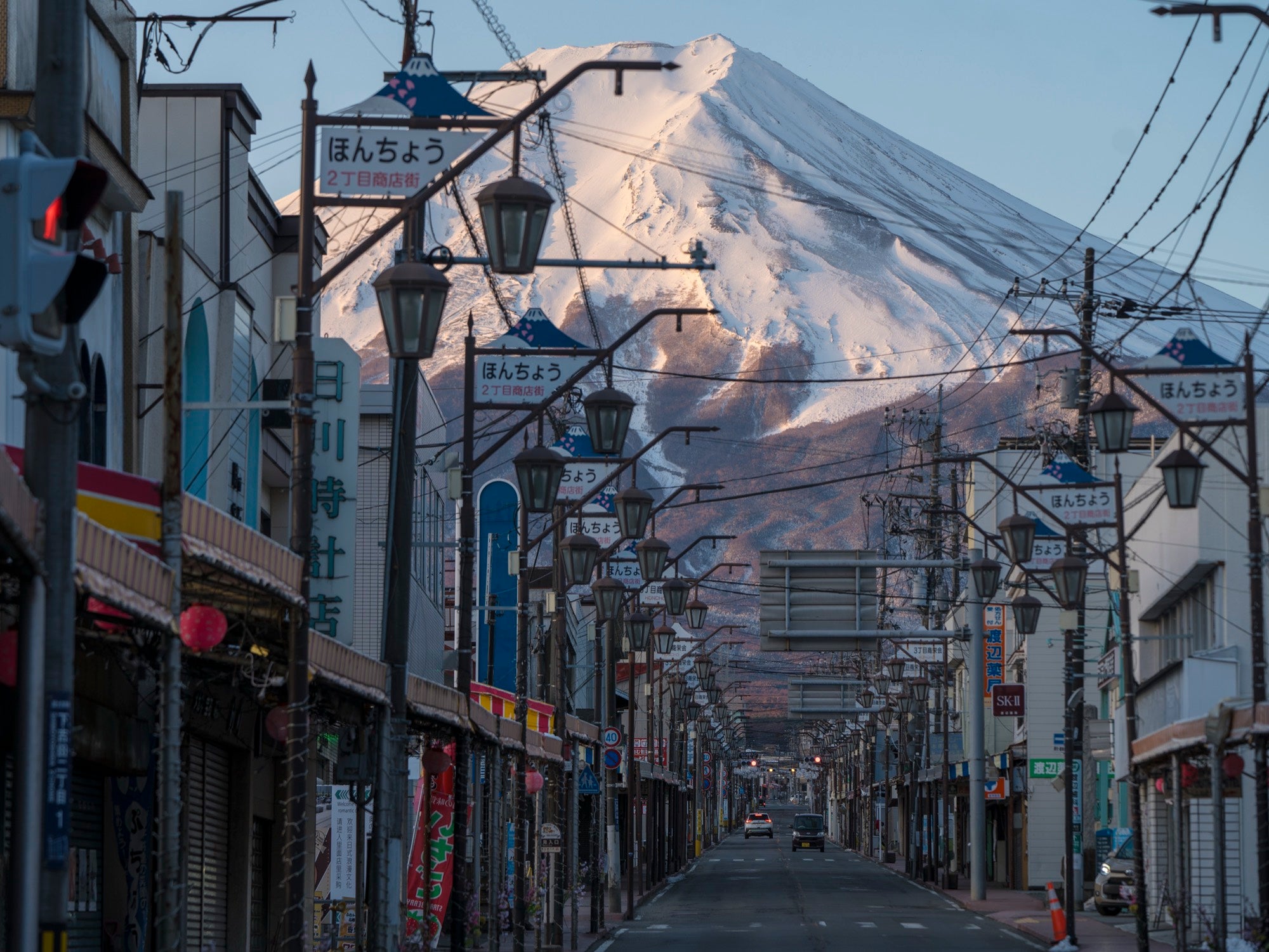 Mt Fuji rising over an old shopping street in Fujiyoshida, Japan