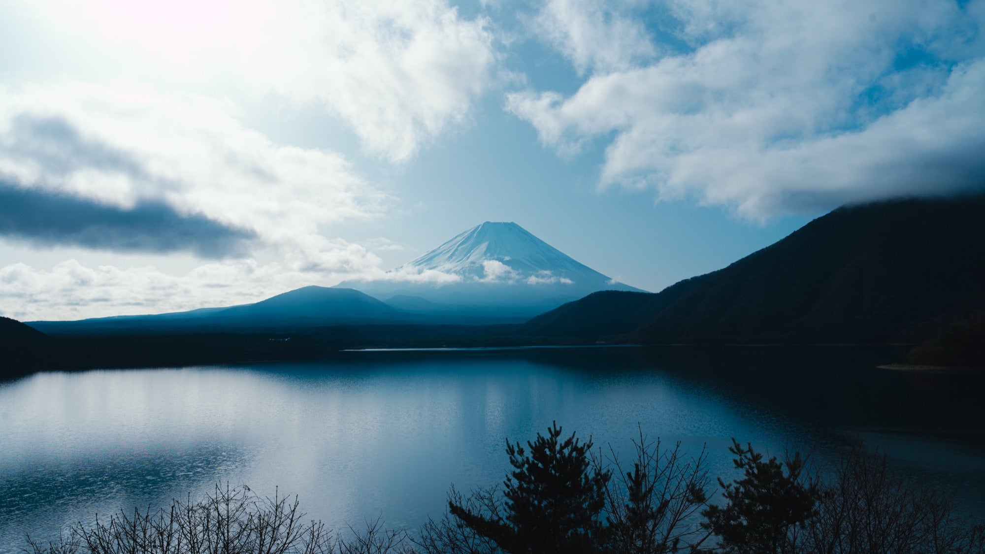 Mt Fuji veiled in cloud over the lake